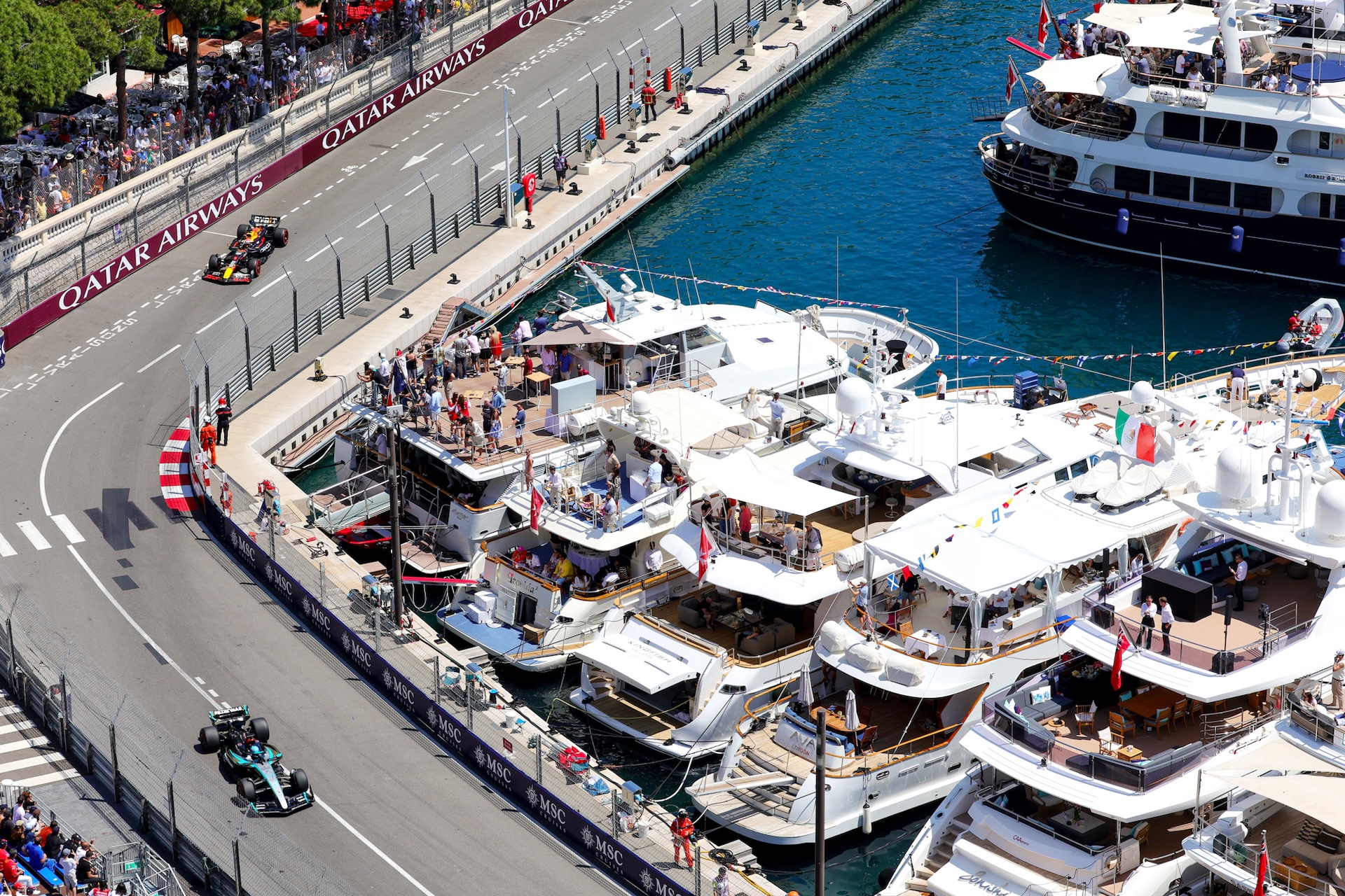 Monaco Formula One Grand Prix corner overlooking luxury yachts in Port Hercule – premium corporate hospitality and incentive events