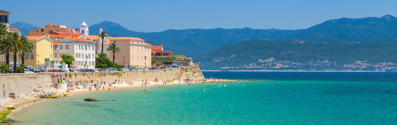 Scenic view of Porto-Vecchio, featuring boats and the crystal-clear Mediterranean waters of southern Corsica.