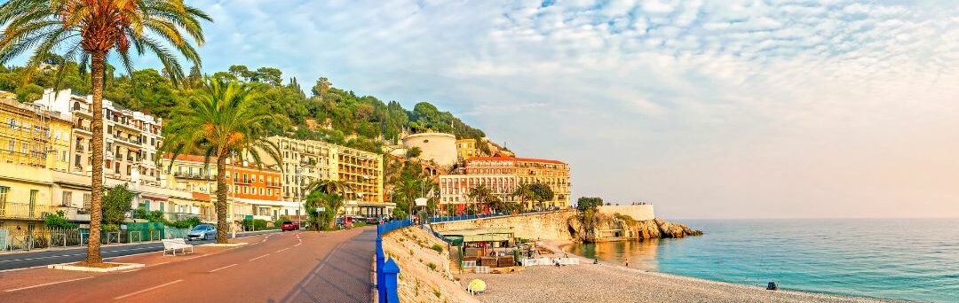 View of Nice beach and the Promenade des Anglais along the Mediterranean coastline.